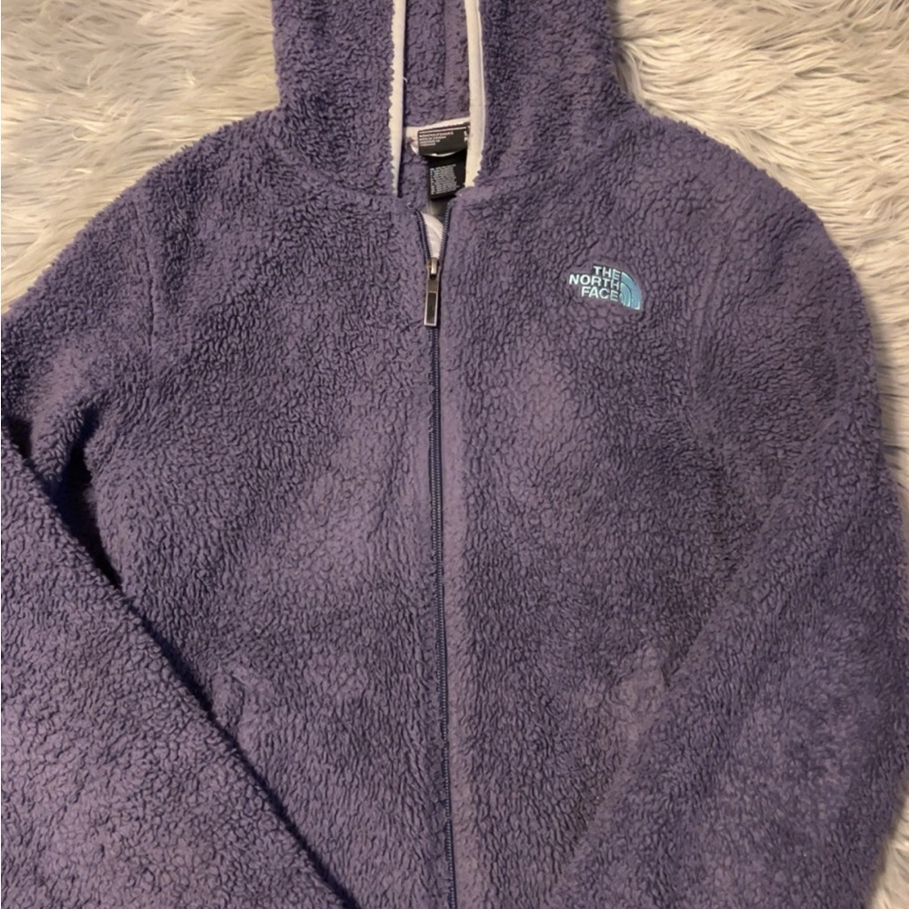 Purple north face fuzzy jacket. Has some wear, but still has a lot of life left!